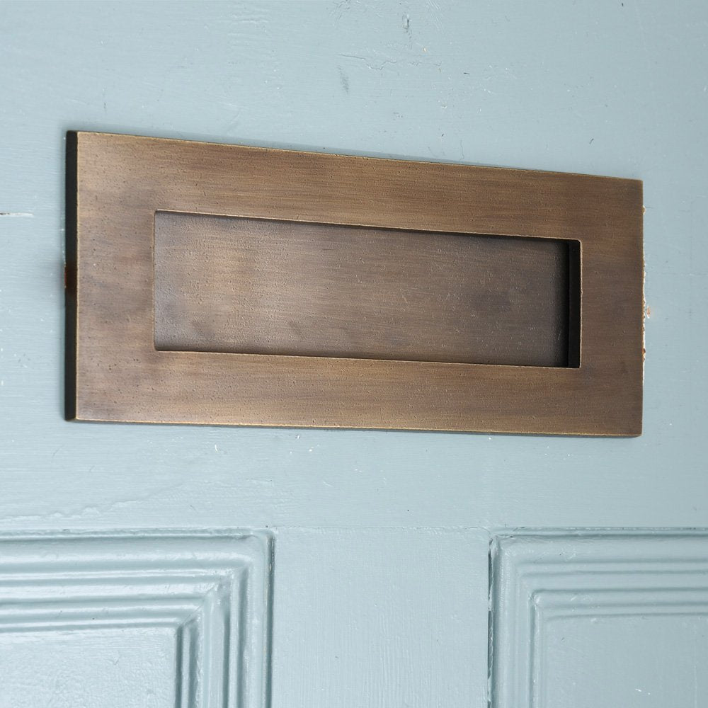 Distressed Antique Brass Plain Letterplate on Blue Door