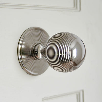 Alternate angle of solid brass Large Beehive Door Pull plated with polished nickel.