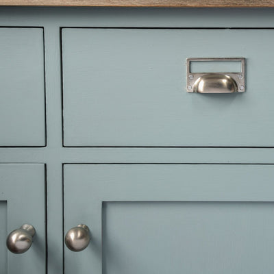 Solid brass Hooded Pull with Card Frame in Satin Nickel plated finish on cupboard drawer.