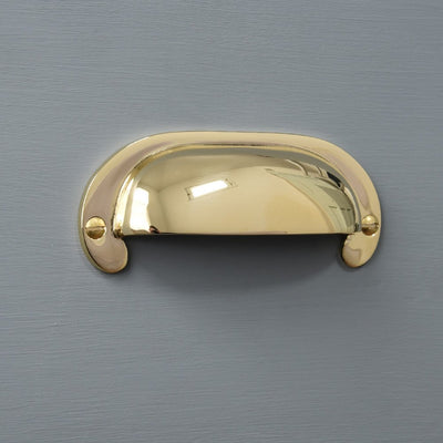 Large Curved Hooded Pull in polished brass.