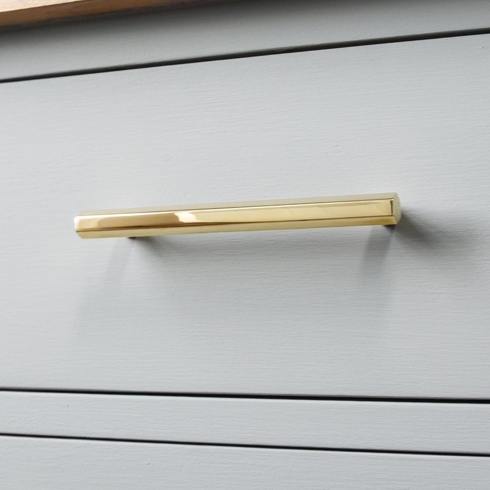 Polished brass Hex Pull Handle on drawer.