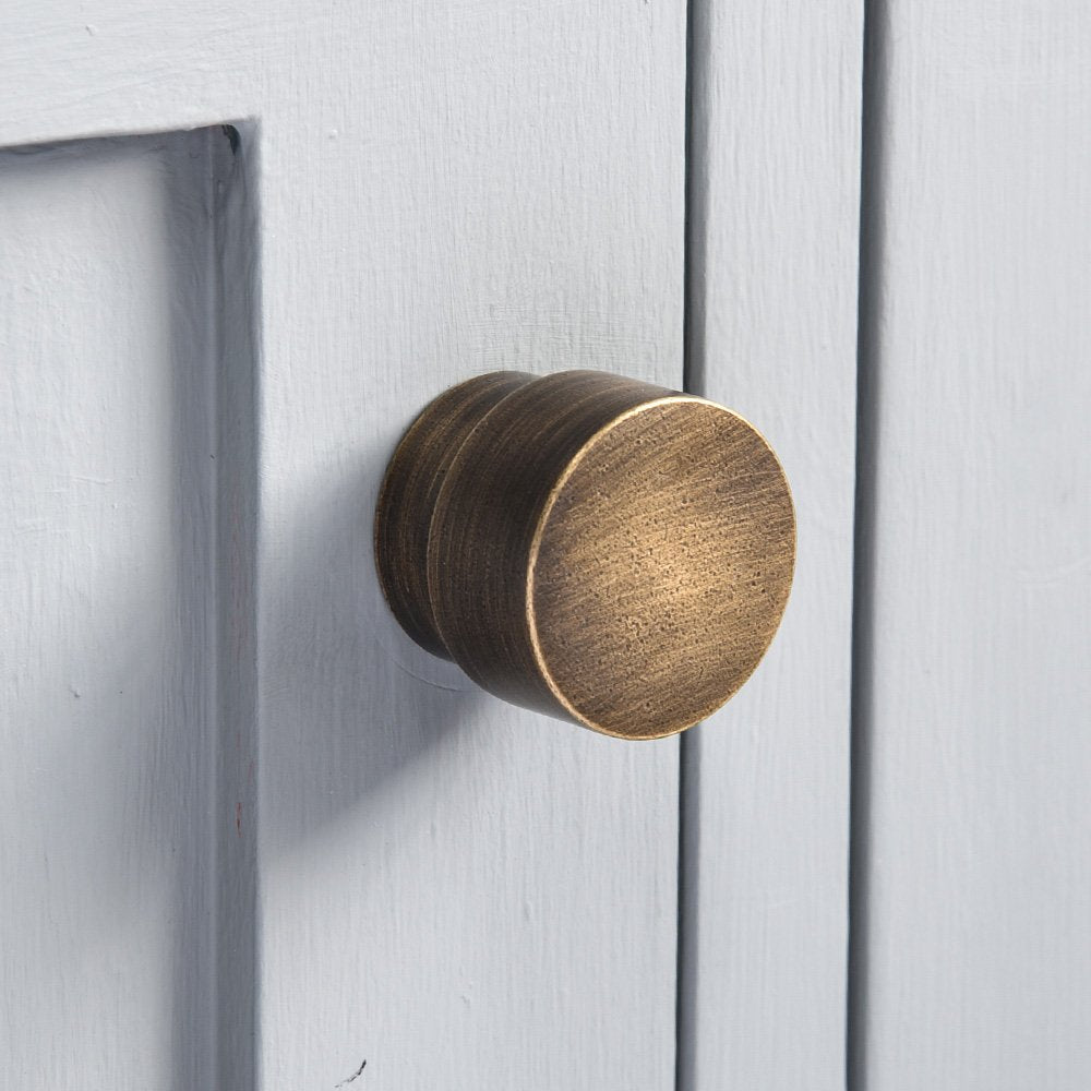 Solid brass weighty and contemporary Drum Cabinet Knob with distressed antique brass finish by hand