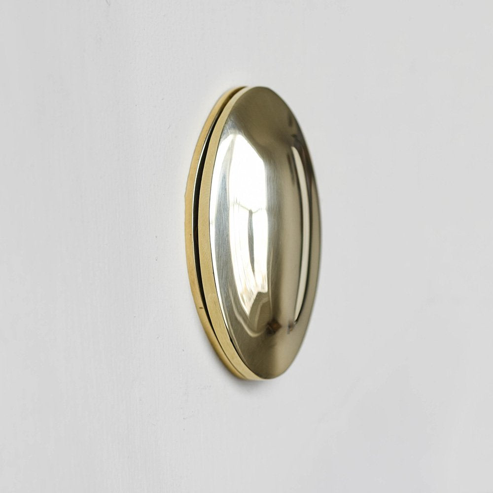 Polished solid brass oval covered escutcheon.