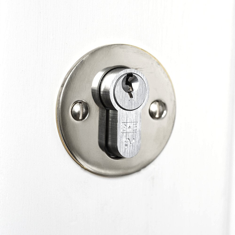 Solid brass circular escutcheon with polished nickel finish, mounted over euro cylinder lock.