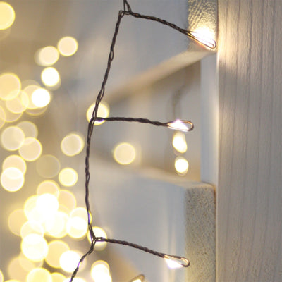 Close-up of fairy lights with warm toned LEDs and brown/copper wire