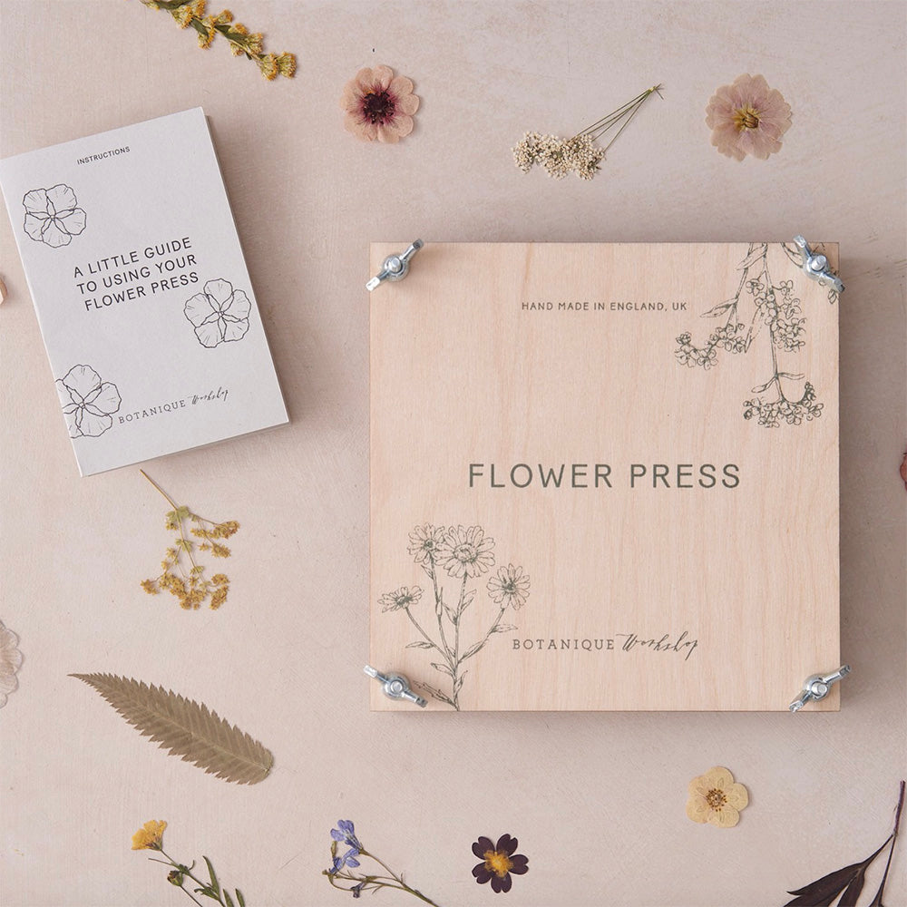 beautiful wooden flower press with metal fasteners