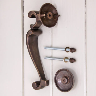 Components of Doctors Door Knocker including knocker, bolts and striker plate.