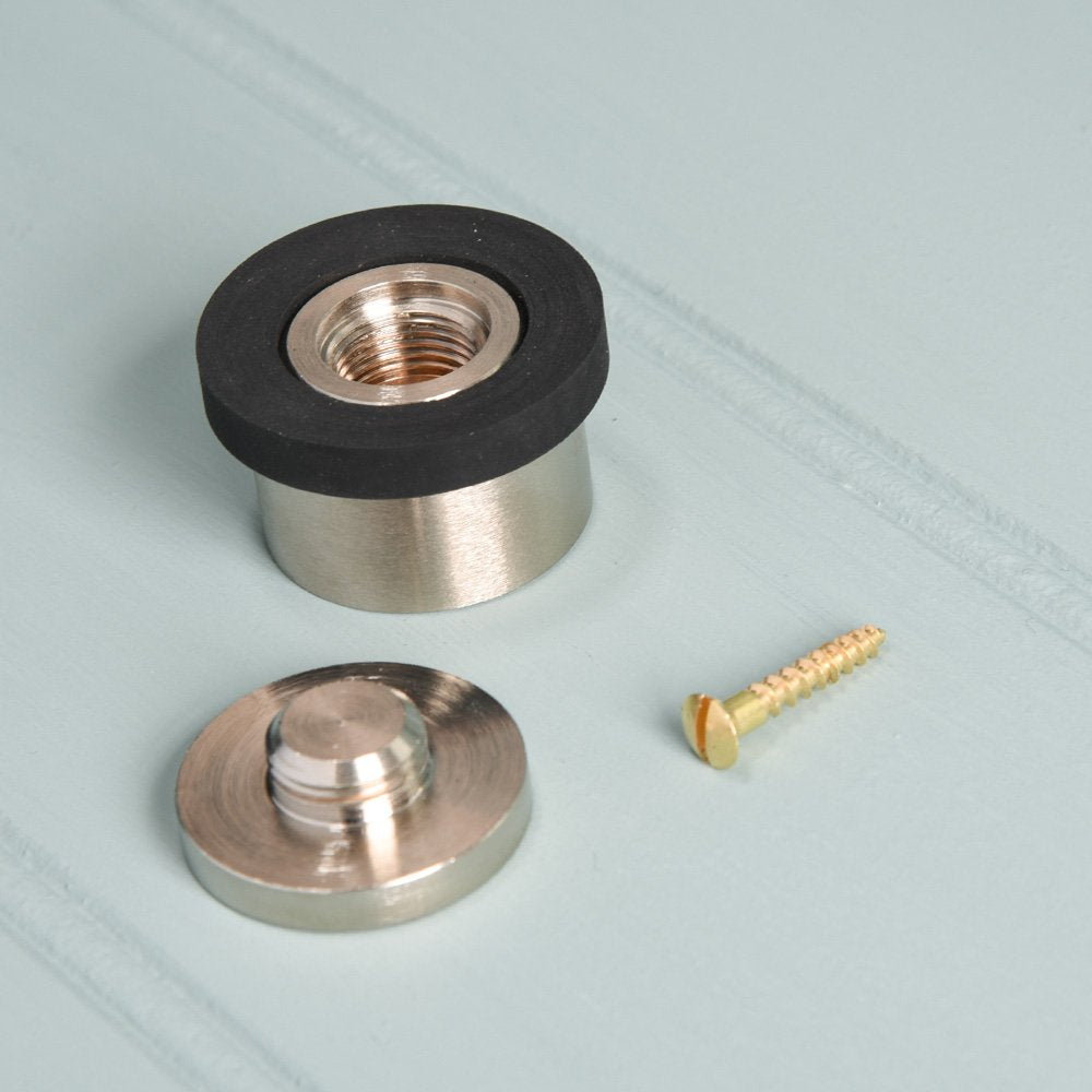 Components of solid brass Heavy Door Stop in satin nickel finish with rubber rim.