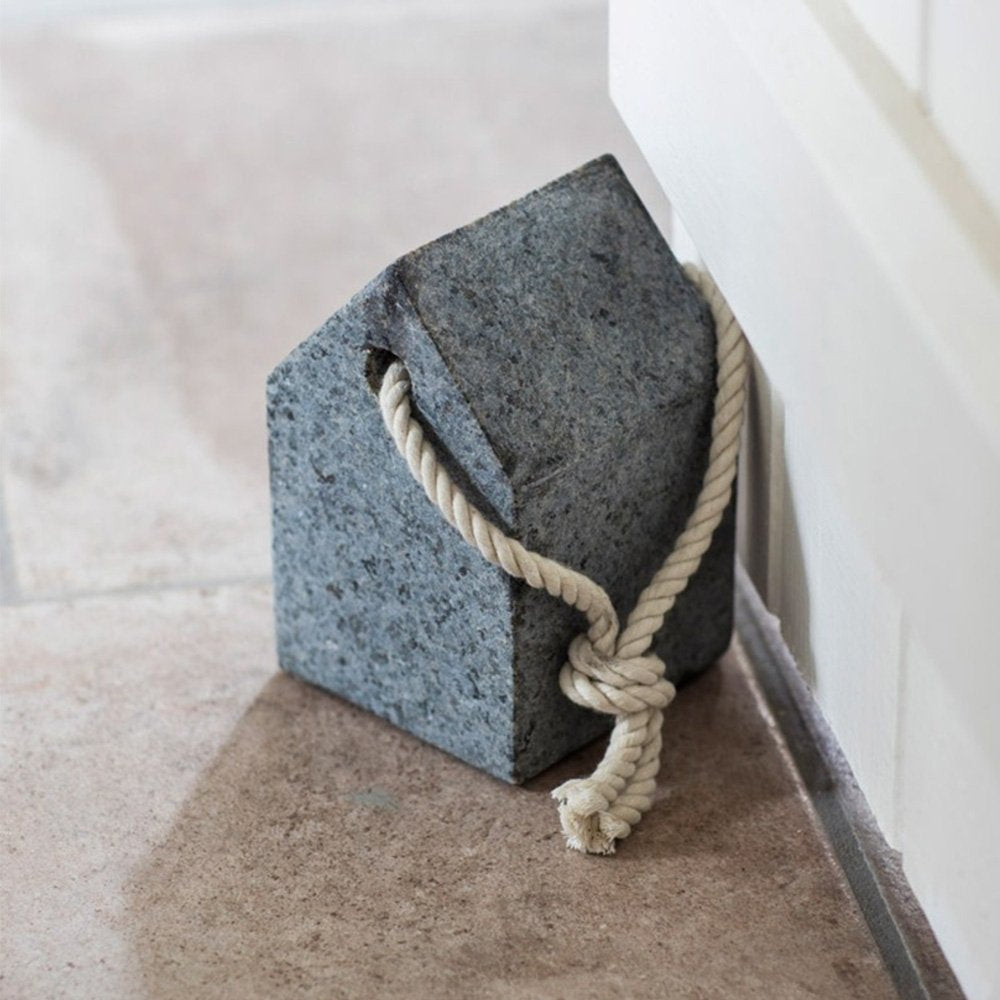 House/pentagon-shaped granite door stop with cream carrying rope