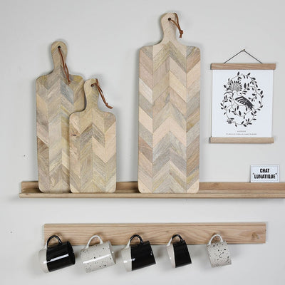 Three Herringbone Wooden Chopping Boards in Medium, Small and Large on Kitchen Styled Shelves