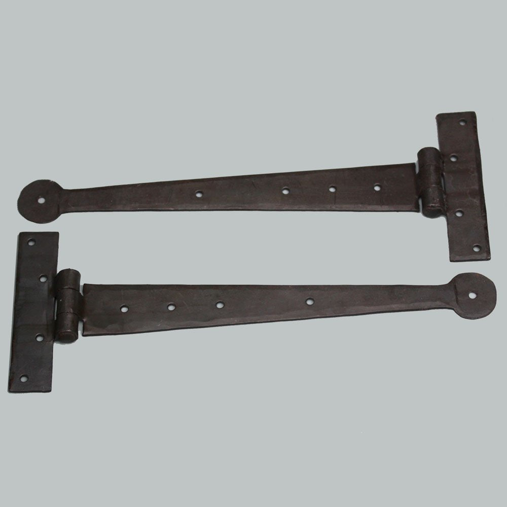 A pair of forged black beeswax T hinges