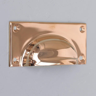Close up of solid bronze Gun Metal Hooded Drawer Pull.