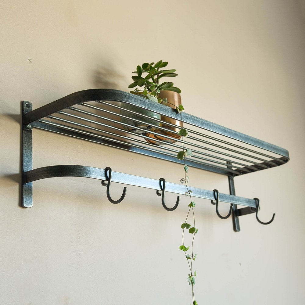 Steel shelf with rounded edges and hook rail below