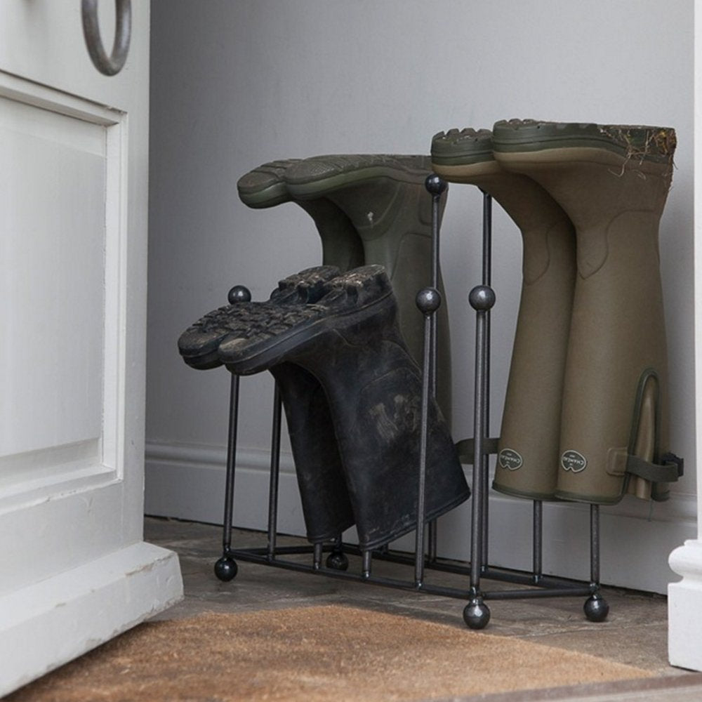 Large industrial style wellington boot stand holding wellies