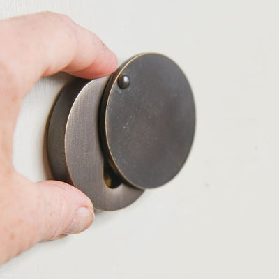 Demonstration of Round Euro Escutcheon with Cover - Distressed Antique Brass.