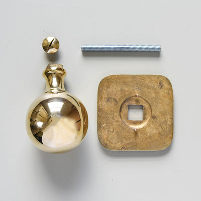 Components of Large Brass Door Pull with Square Backplate.
