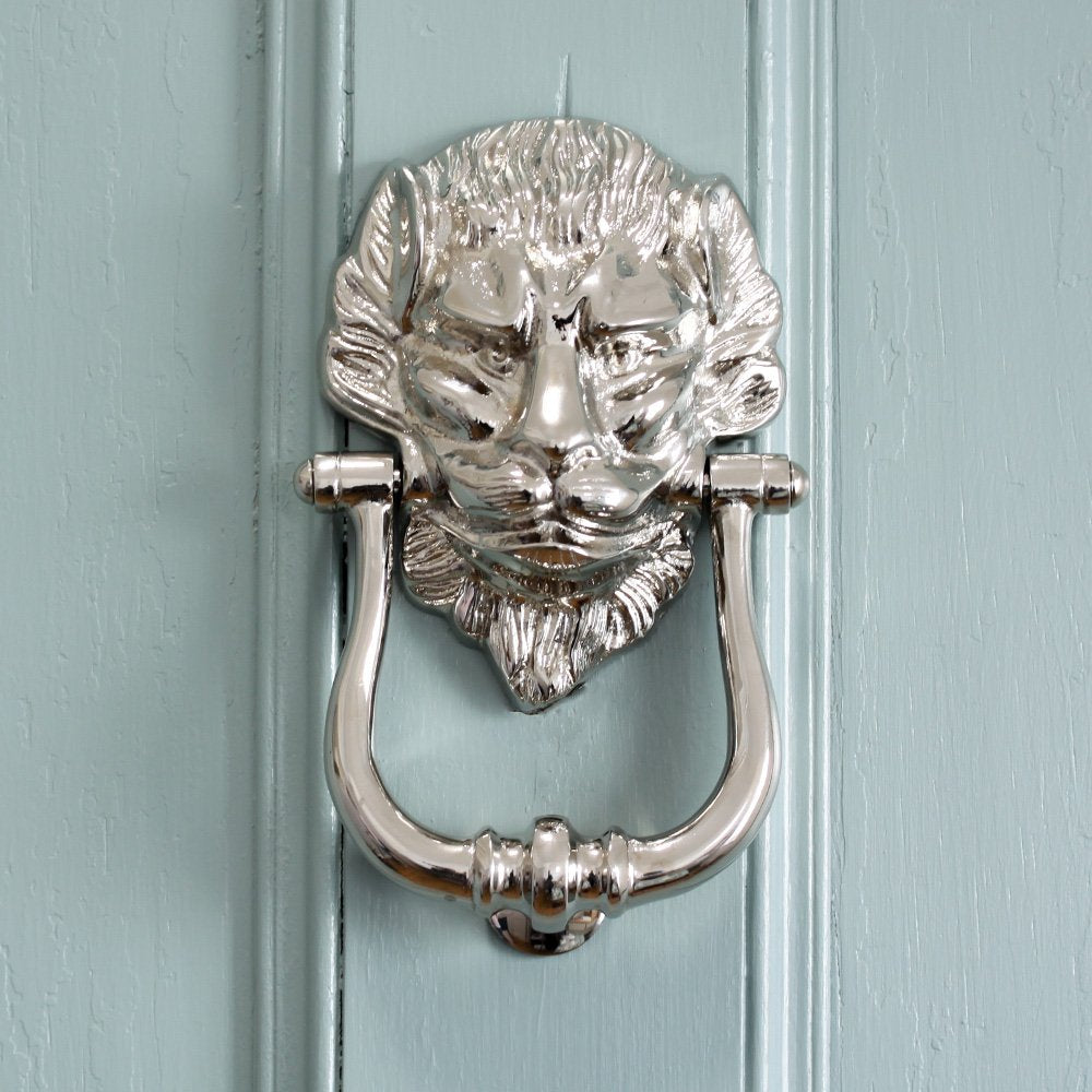 Solid brass Large Nickel Lion Door Knocker on blue door.