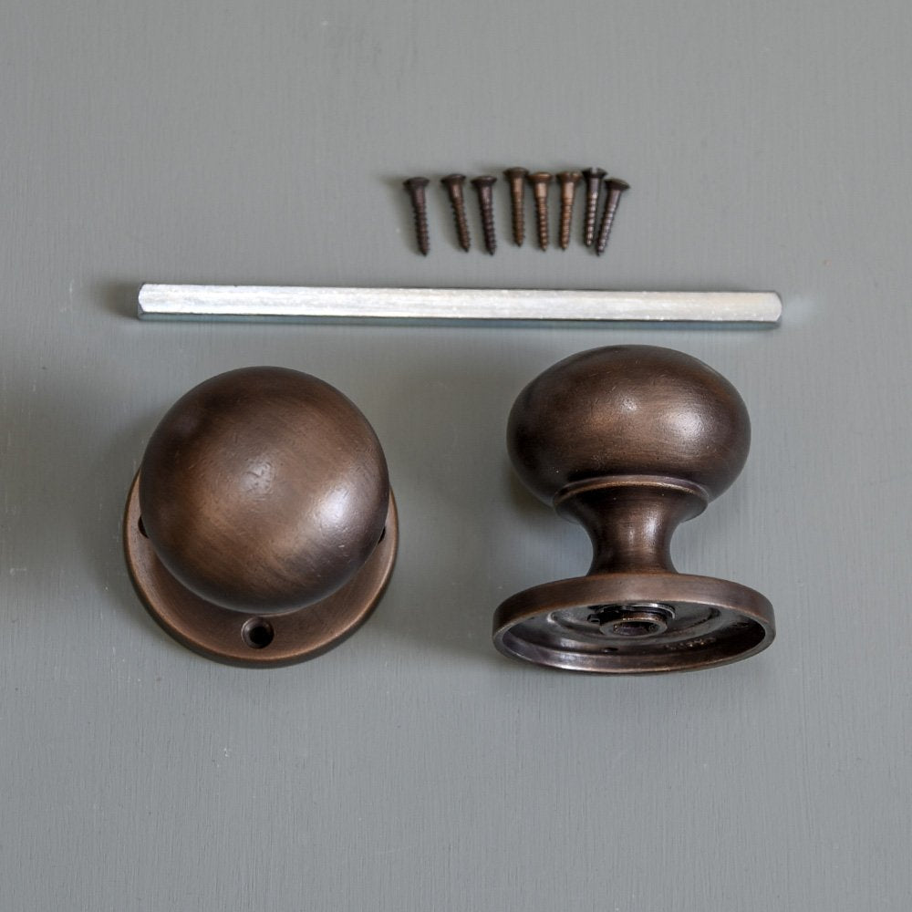 Components of Large Bun Door Knobs in distressed antique finish.