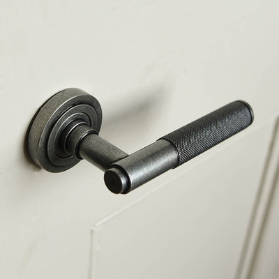 A Brompton lever handle showing the rose set backplate