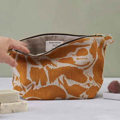 100% linen wash bag with zip in mustard and white creatures design