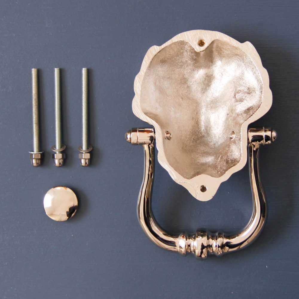 Components of Large Nickel Lion Door Knocker including bolts, knocker and striker plate.
