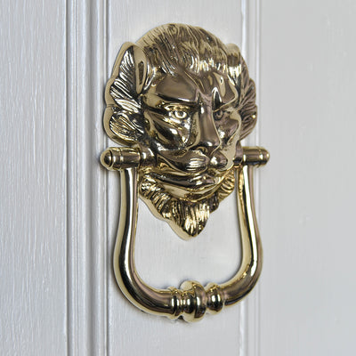 Solid Large Brass Lion Door Knocker on door.