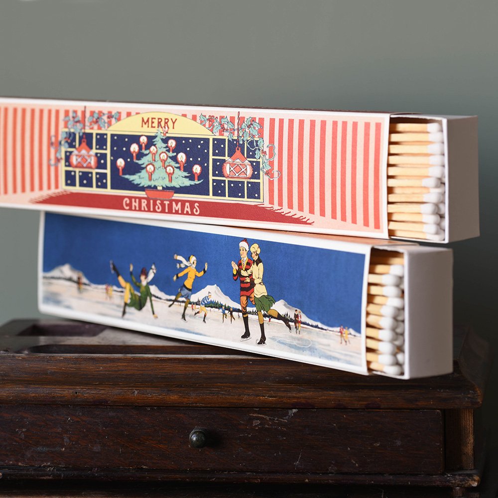 Two Boxes of Extra Long Luxury Matches in the 'Merry Christmas Fireplace' and 'Skating' Winter Collection Designs