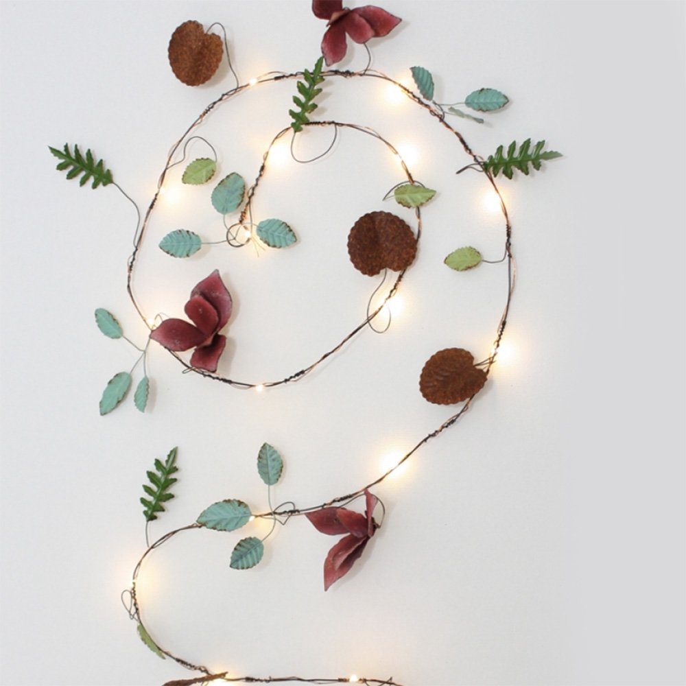 Multi-coloured metal leaf garland with LEDs coiled around in a swirl