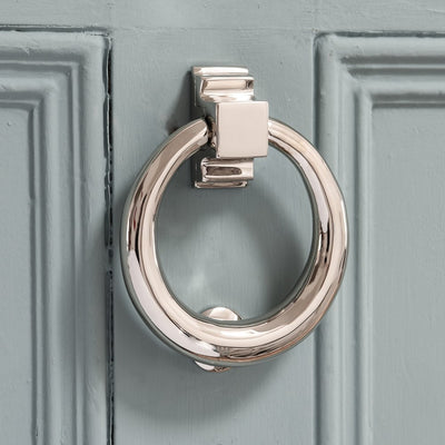 Solid brass Hoop Door Knocker in Polished Nickel plated finish on blue door.