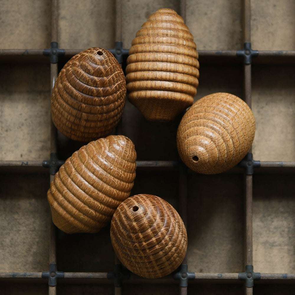Solid oak light pulls shaped as a beehive