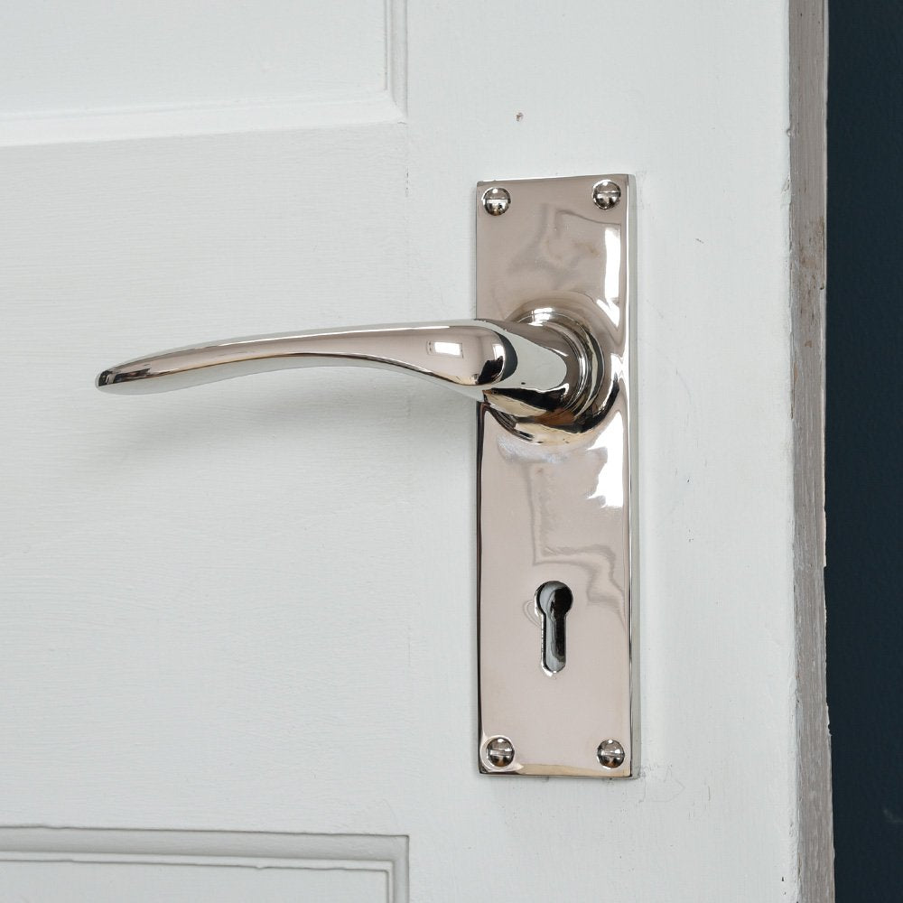 Oaken Lever Handles with Rectangular Backplate in Polished Nickel