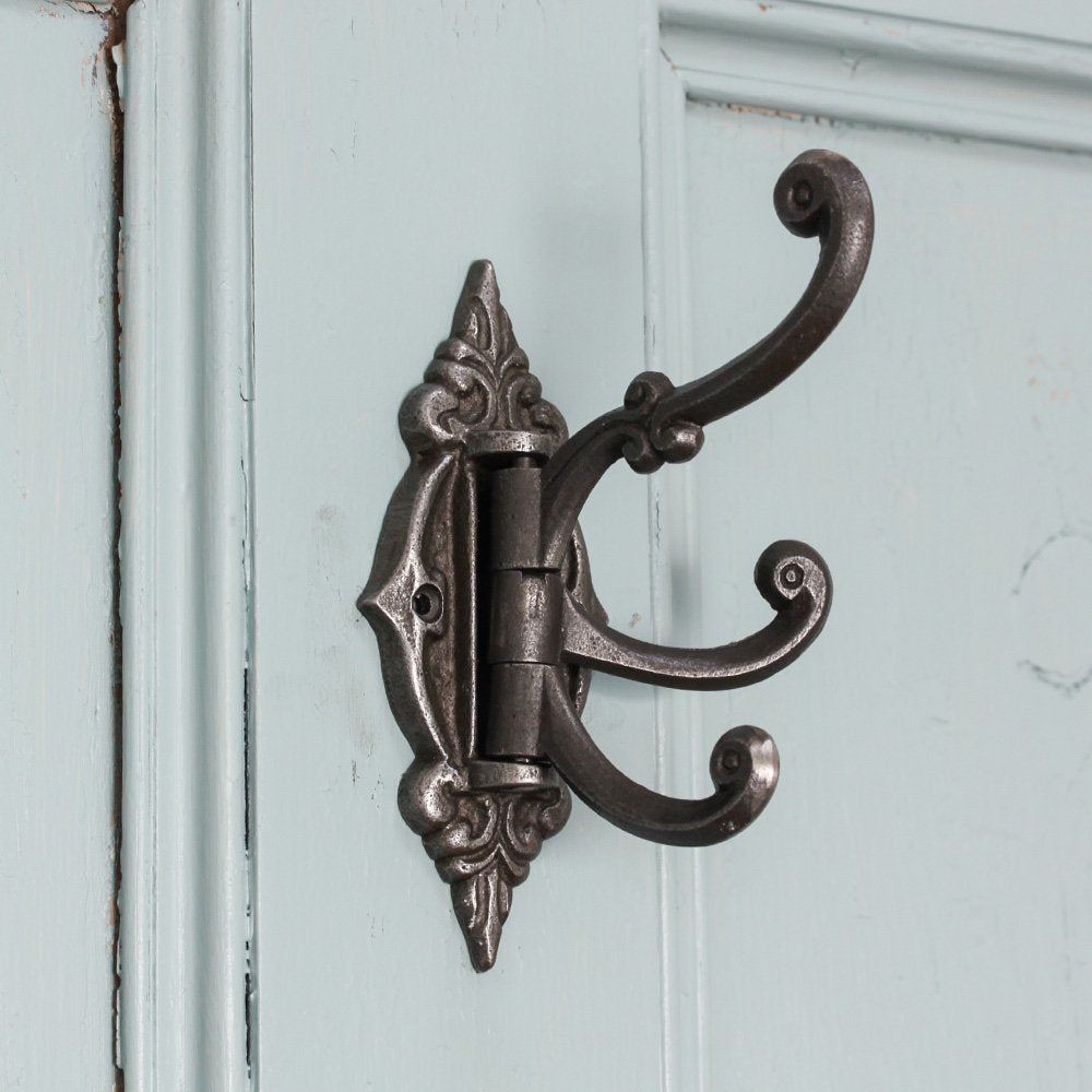 Ornate Hinged Triple Hook in Cast Iron on Wall