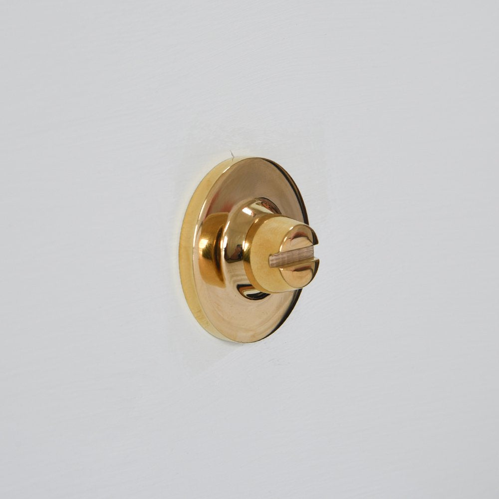 Back of Oval Bathroom Thumbturn in Polished Brass