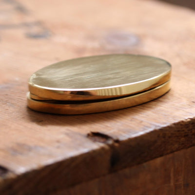 Oval Covered Escutcheon in Polished Brass Side View