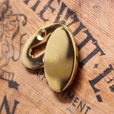 Oval Covered Escutcheon in Polished Brass