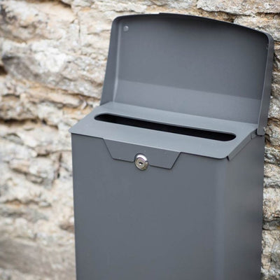 Charcoal grey post box with lock