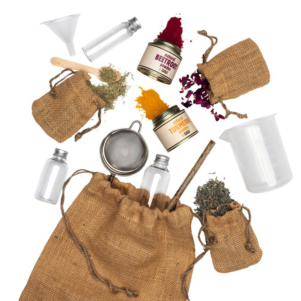 Potion making kit with herbs, spices, a sieve, a beaker and potion bottles with a drawstring hessian bag