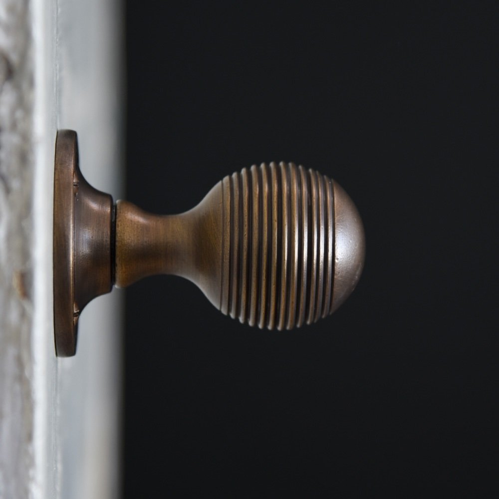 Side view of Reeded Beehive Door Knobs in Distressed Antique finish.