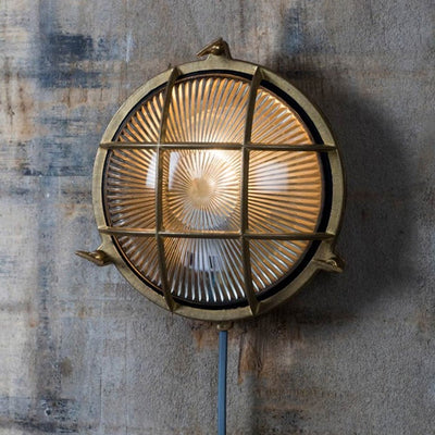 Round brass finish bulk head light with cage detail