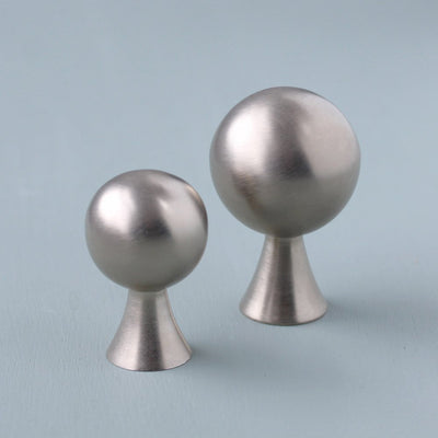 Ball shaped cabinet knobs in two sizes with tapered neck