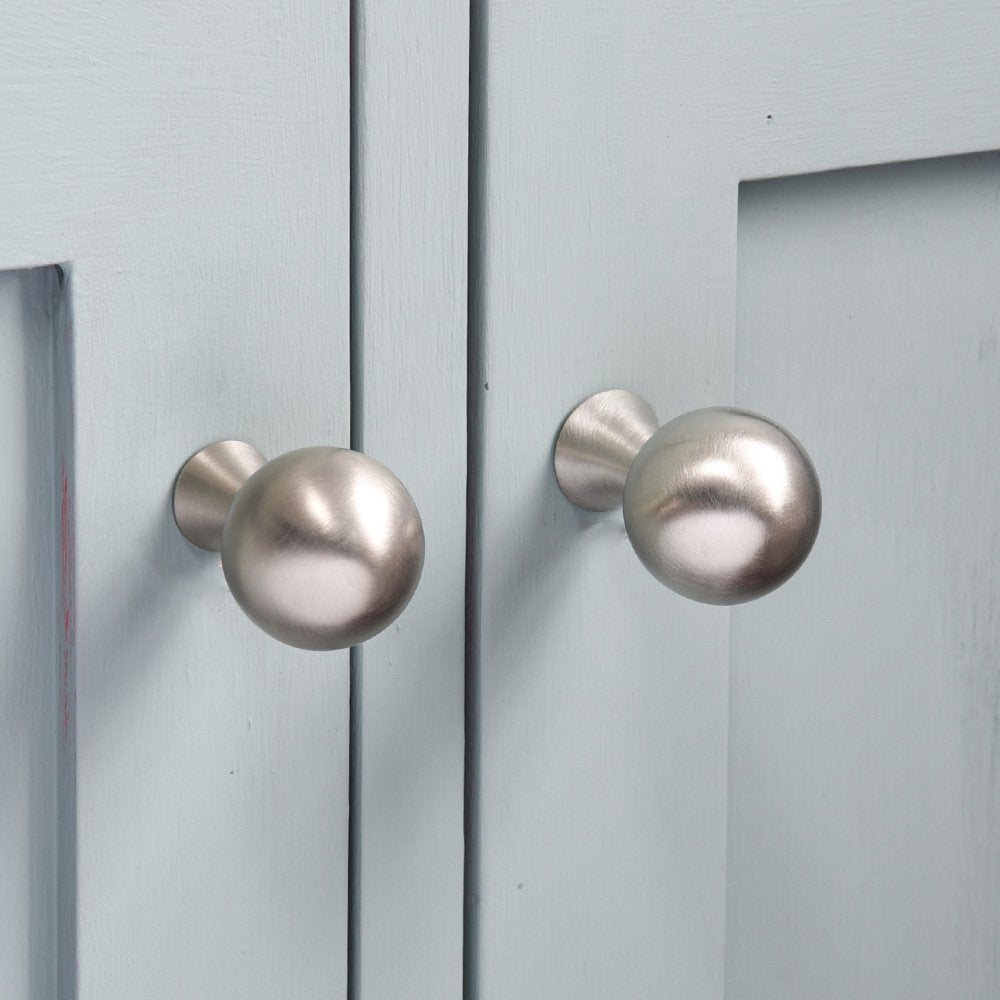 Ball shaped cabinet knob on tapered stem