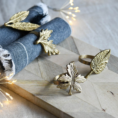 Set of 4 Leaf Shaped Napkin Rings in Antique Brass, in Use on Napkins