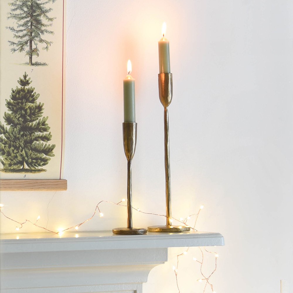 Slender Brass Candlesticks in Small and Medium on a Festively Styled Shelf
