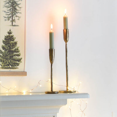 Slender Brass Candlesticks in Small and Medium on a Festively Styled Shelf