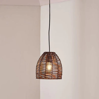 Small size dark rattan conical lampshade hanging against taupe painted walls