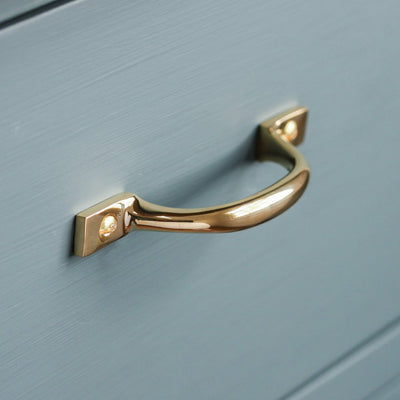 D' Shaped Pull Handle in Brass on blue drawer