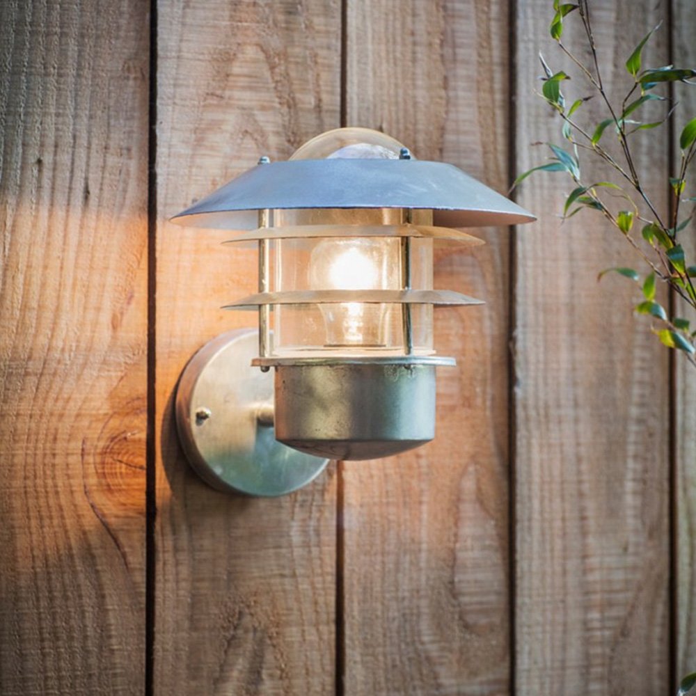 St Ives galvanised steel wall mounted outdoor light with cage detail around glass shade to give nautical feel