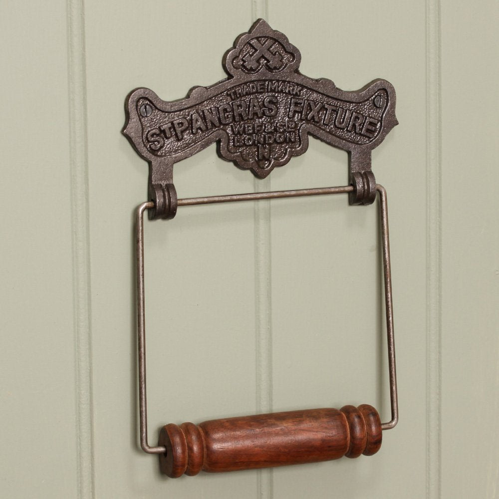 Ornate Cast Iron Toilet Roll Holder with 'ST PANCRAS FIXTURE' Text and Wooden Roller