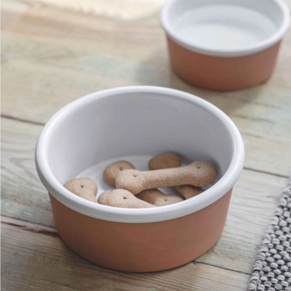 Stoneware pet food or water bowl with matt terracotta finish on outside and glossy white finish on inside