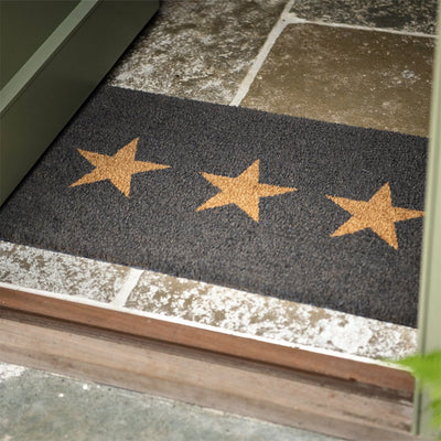 Charcoal coir doormat with three tan brown stars